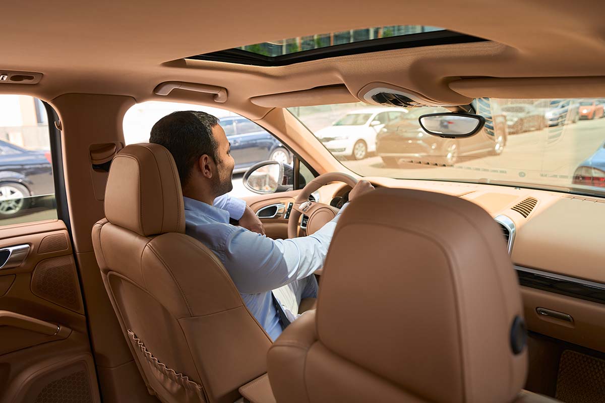 driver sitting in motor vehicle taxi rides